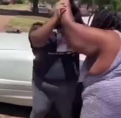 Two horizontally challenged women really going at each other in parking lot