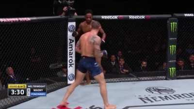 Ponzinibbio chopping Neil Magny legs with brutal low kicks.