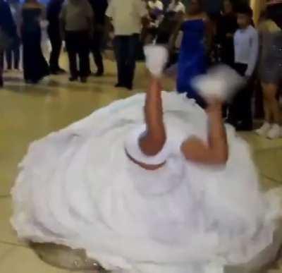 By the bride to do a handstand at her wedding