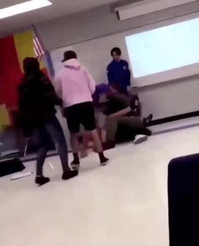 Teacher gets punched for trying to stop a lame fight