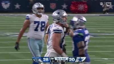 Jake Ferguson let's Quandre Diggs and Jamaal Adams know that he got the first down