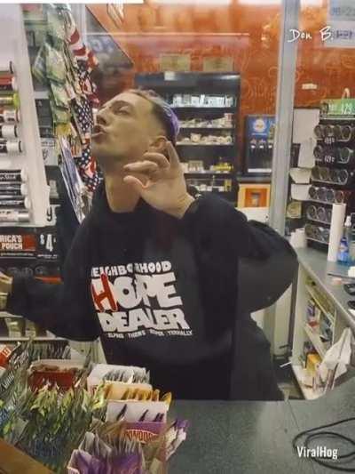 Gas station cashier off his head