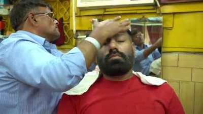 Legendary Indian barber Sarwan demonstrates ancient forehead tapping massage technique