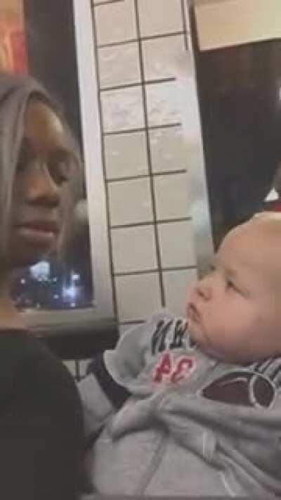 Baby Stares At Woman Then Smirks