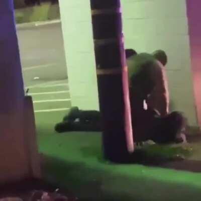 They secluded him behind a wall and looked around to see if anyone was watching so they can beat him... this is why we protest