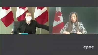 Turdeau's deputy PM, Chlamydia Freeland, scrambles to put her mask on for the camera.