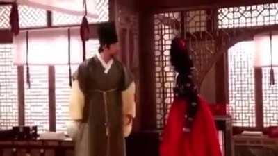 Man bounces his big ball on someone's face.