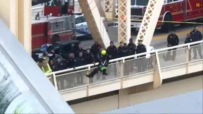 Daring Rescue Of A Semi Truck Driver, that was dangling over the river