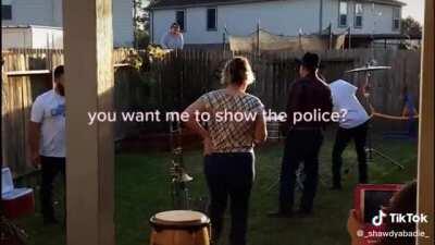 Karen doesn't like banda music, and hoses a party with people in THEIR OWN yard .