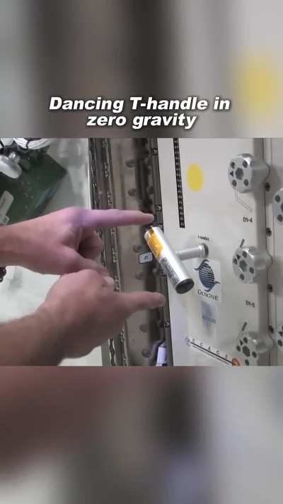 Dancing T-handle in zero gravity