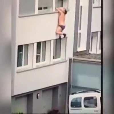 Trying to escape by hanging out from a window