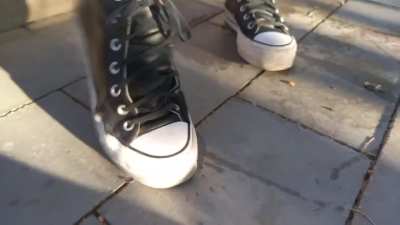 Girls crush snails with converse