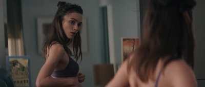 Getting ready for a date in 'Last Night' (2010).