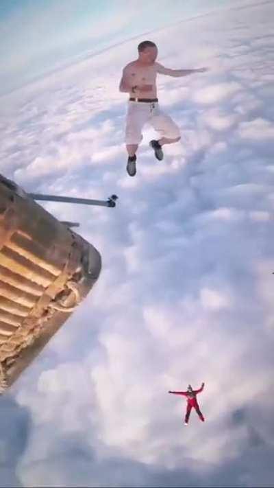 Man jumping from hot air balloon without parachute