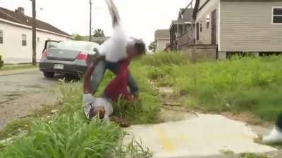 Thug gets beat up, chain snatched, and disarmed during a news report on violence in the area