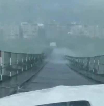 A heavy rainstorm made a bridge dance in the mountains of southwestern China.