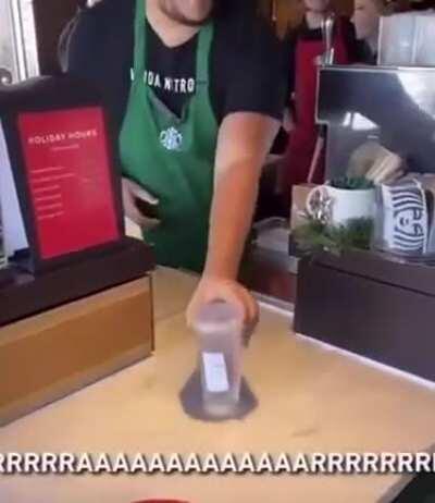 Starbucks employee reading out an order