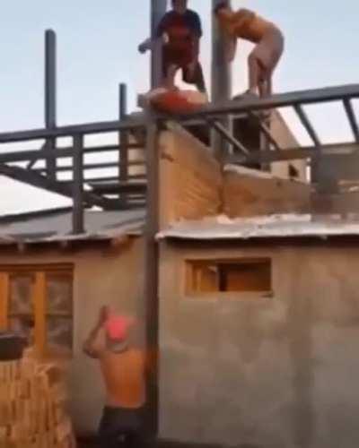 Playing catch with an 80lb bag of concrete mix