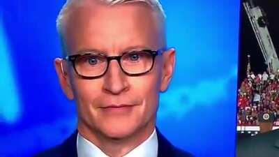 Anderson Cooper tries valiantly to keep a straight face as 'Macho Man' by The Village People plays at Trump rally