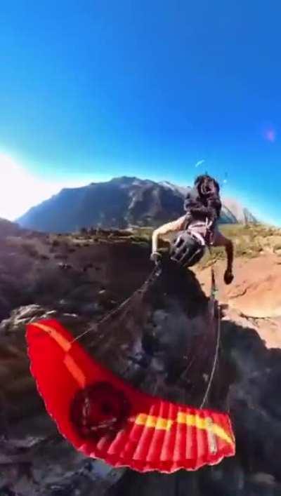 Skydiver glideing close to Mountain and doing 360°s