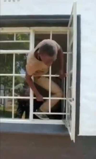 Burglar Breaks Into House, Later Caught By Police And They Asked Him To Demonstrate How He Went Through That Small Hole.