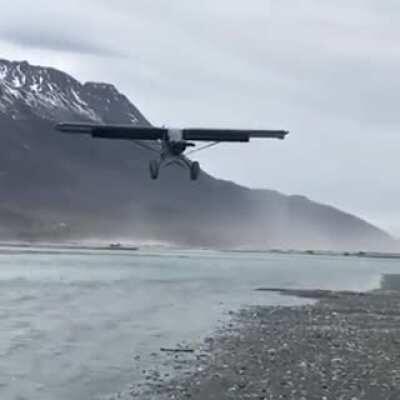 STOL (short takeoff and landing) aircraft in strong headwinds is virtually hovering mid-air during landing