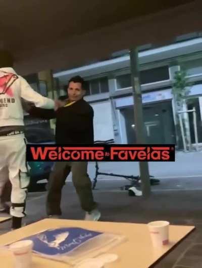 2 against 1 fight while man plays ukulele in Macerata, Italy