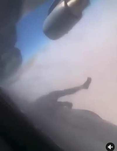 A dead body hanging from the airplane posted earlier