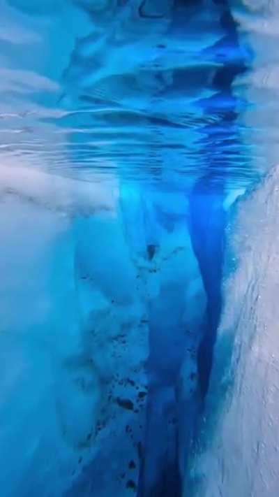 What it looks like under this glacier pool in Iceland. Video Credit : John Derting
