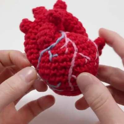 A crocheted anatomical human heart