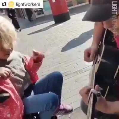 Blind autistic girl meets busker