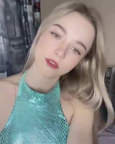 Cute blonde in snakeskin bodysuit