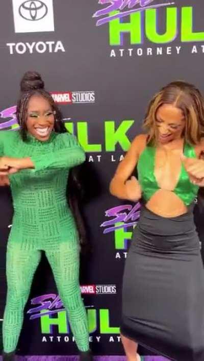 Sasha and Naomi dancing on the purple carpet.