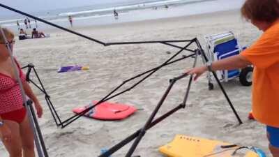 Two Karens caught stealing a canopy on the beach and then attack.