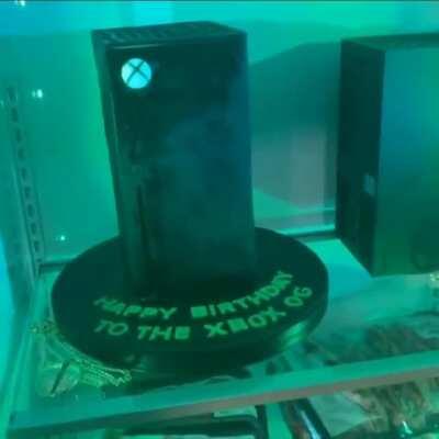 Xbox Series X and Xbox Series X cake in an Xbox Series X fridge opened by Snoop Dogg