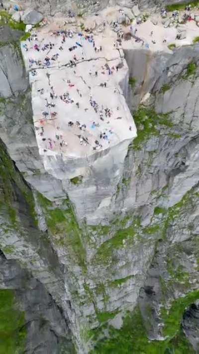 Hanging out in the cliff of Preikestolen, Strand Rogaland Norway
