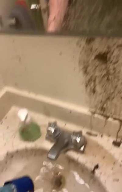 Trying to unclog the drain.