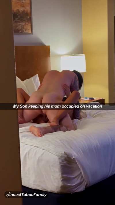 My Son keeping his mom occupied on vacation