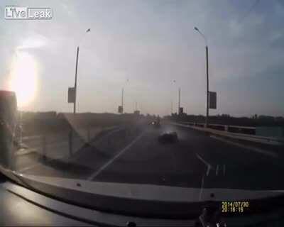 Man on motorbike Flips Onto Moving Car