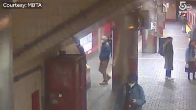 Ceiling panel almost falls on a woman getting off the subway in Boston.