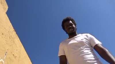 Terry Davis, the creator of TempleOS, greets a black man.