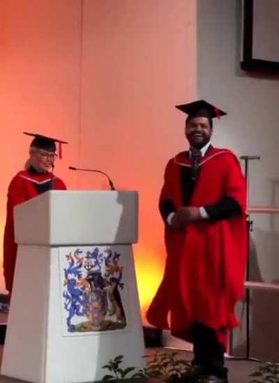 Daughter cheers for her dad at his graduation.💙