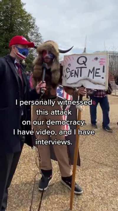 Horned, shirtless man at the Capitol demonstration interviewed by fake OAN reporter