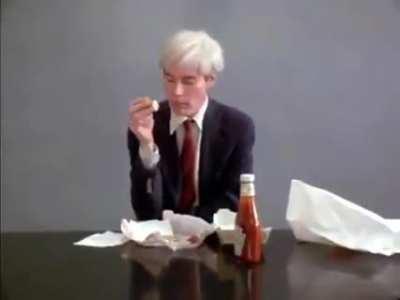Andy Warhol Eating a Hamburger