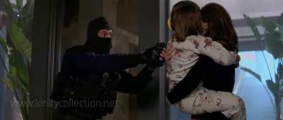 Gina Gershon knees a man in the balls in Face/Off 1997