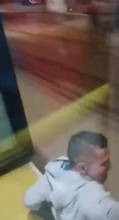 Guy calmly jumps off from a running public transport bus