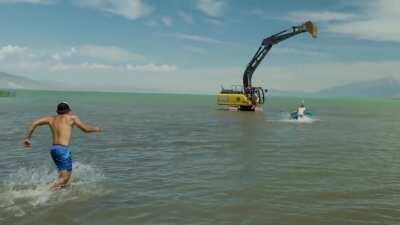 Youtuber increases speed of excavator and suddenly stops with his friend harnessed to it (all for a video)