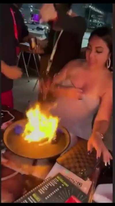 To take a sip of flaming drink