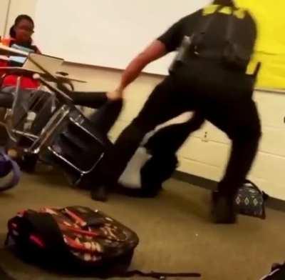 Sheriff body slams high school girl for refusing to leave her seat after being 'disruptive' in class. An internal investigation found no wrongdoing and no charges were filed against him.