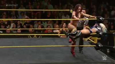 Sasha hits Alexa with double knees to the stomach!